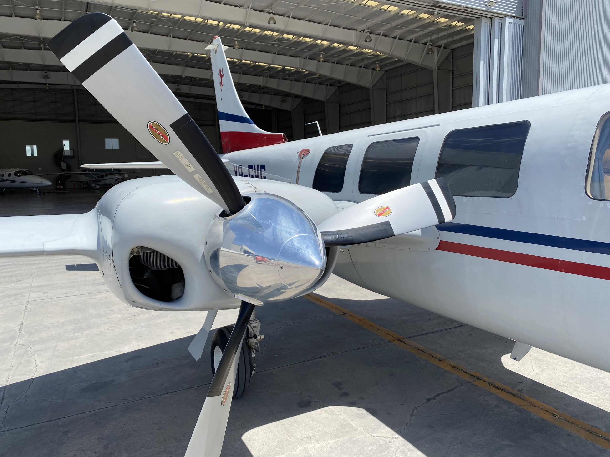Close-up of the XB-GVG aircraft's propeller and side, showing the registration number.